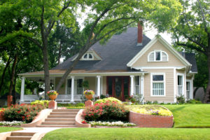 Outdoor shot of a cottage with roofing designed by Secure Roofing